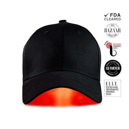 Black cap with red heating element on a white background, featuring awards logos.